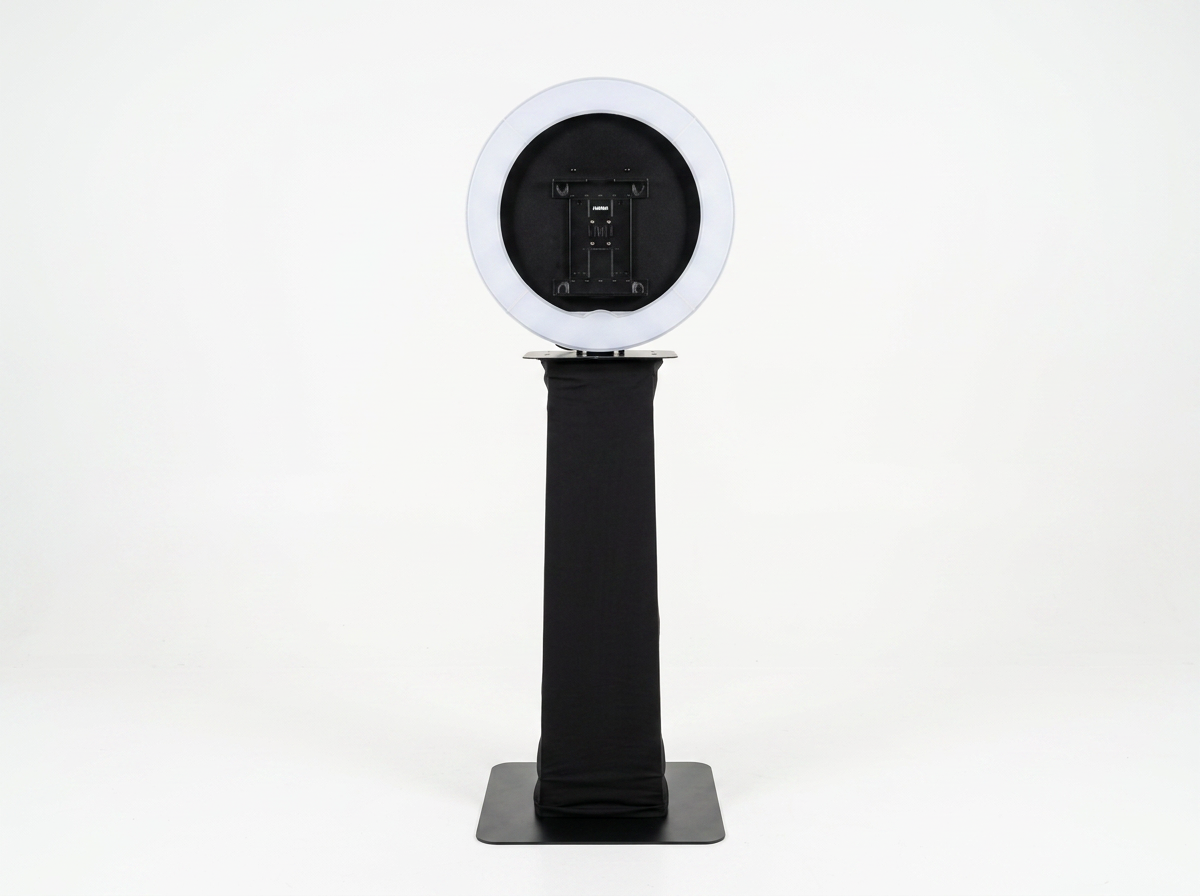 Full open-air photo booth with a large ring light on a clean white background