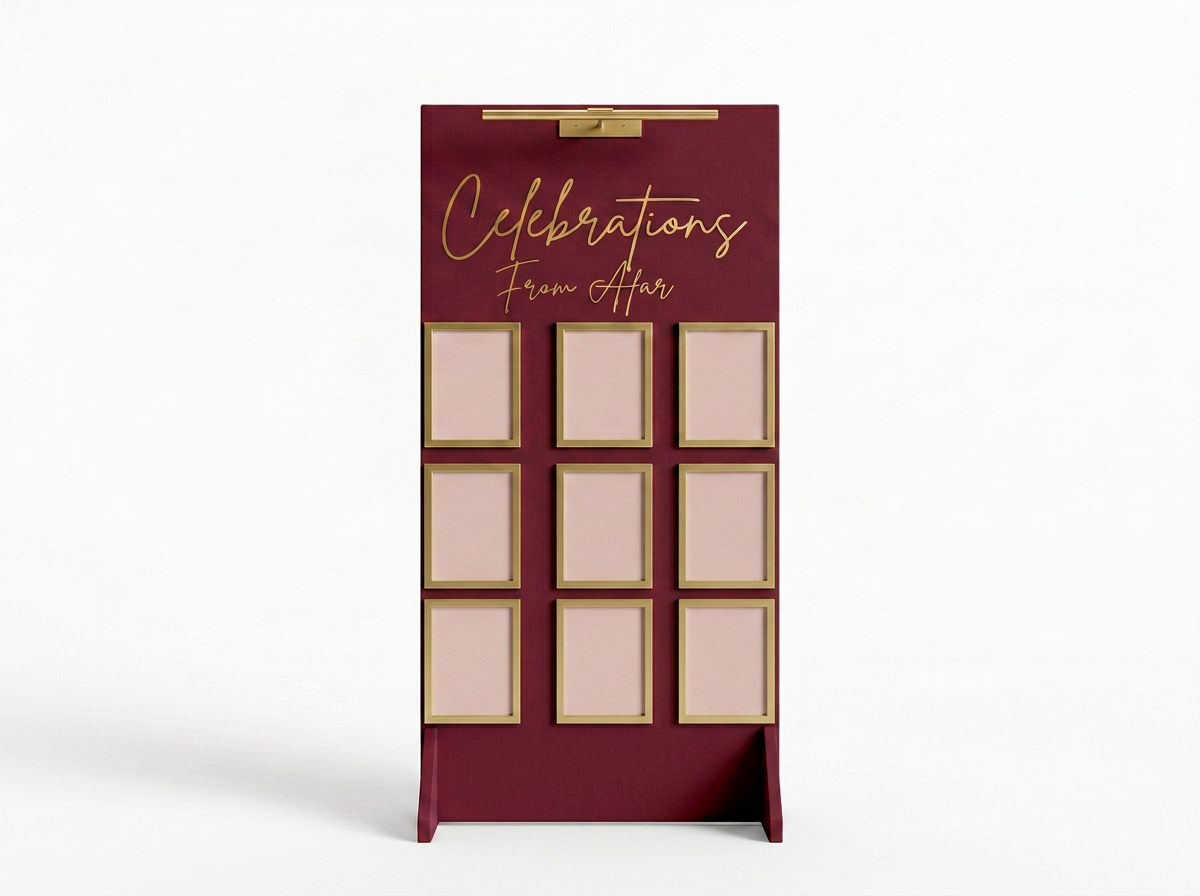 Celebrations From Afar memorial display in burgundy with gold script and gold portrait frames